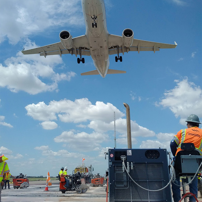 Airport runway maintenance team at work